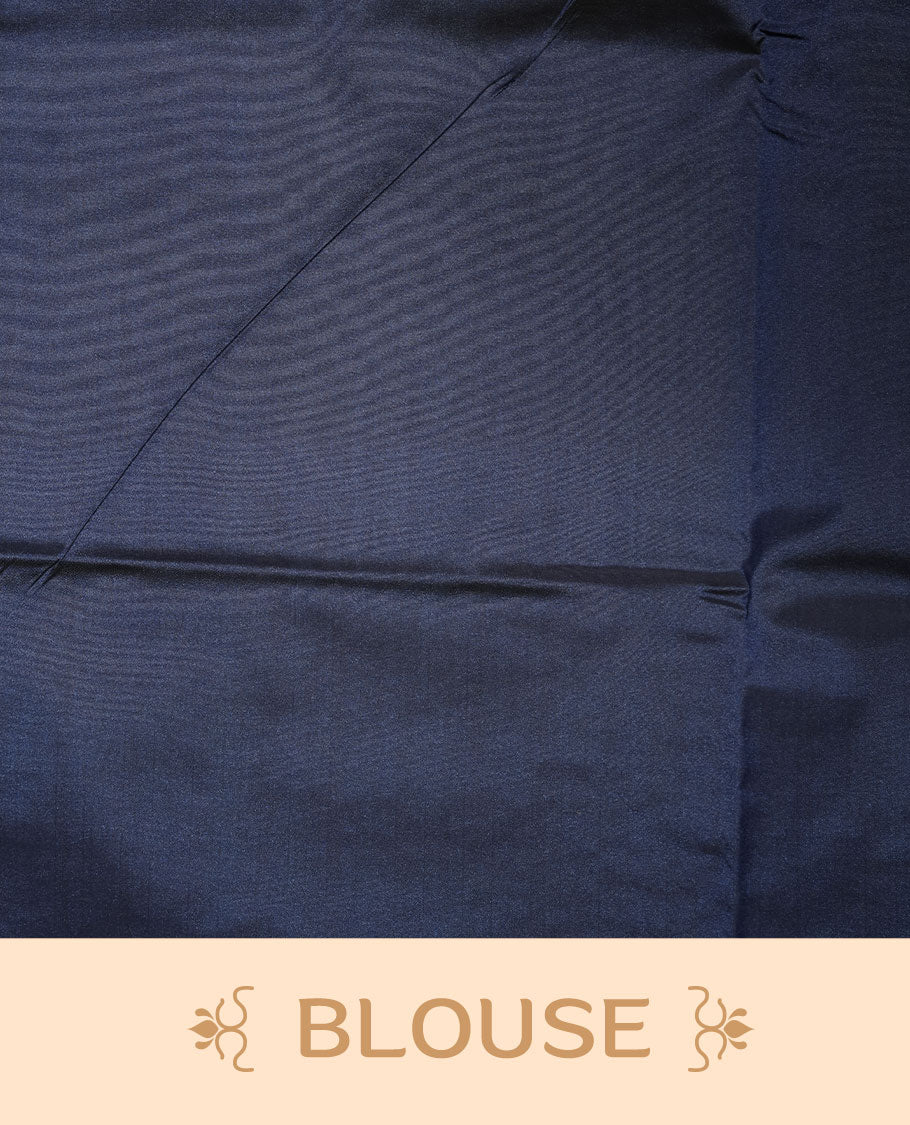 Maroon colour soft silk saree features a sleek borderless design with intricate antique zari motifs, flowing into a striking contrast blue pallu and a matching blouse piece.