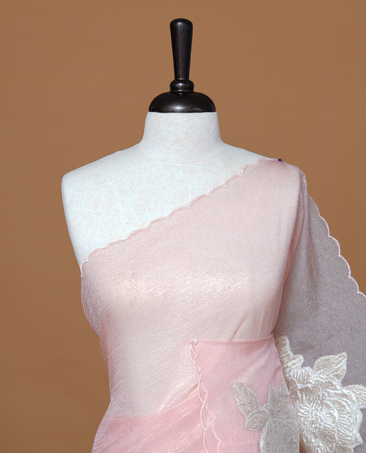 Pastel peach colour Crush Organza Saree featuring White floral Pattern on body, complemented by classy Thread border, paired with matching blouse piece.