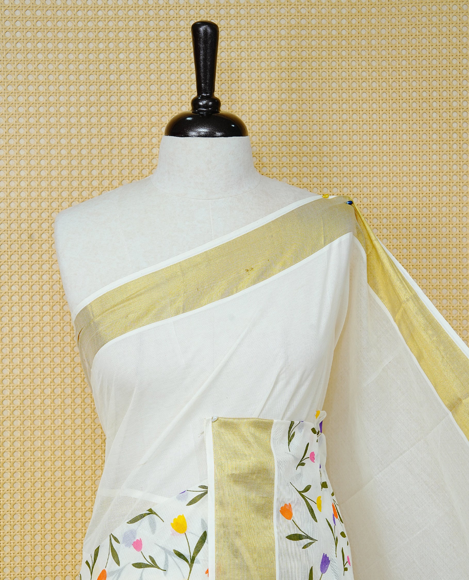 Cream Colour Cotton Kerala Saree Featuring Digital Floral  Motifs On Body, With A Classic Gold Zari Border & A Gold Zari Pallu, Paired With A Matching Blouse Piece.