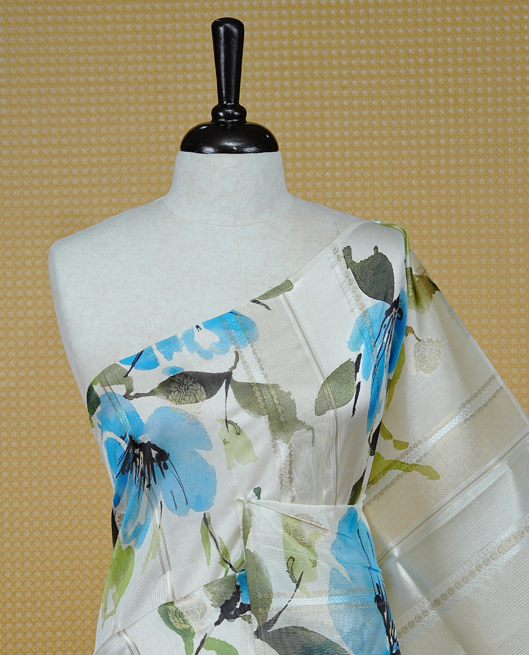 Cream Colour Organza Kerala Saree Featuring Floral Printed Motifs On The Body & Tassels On The Pallu, Paired With A Matching Blouse Piece.