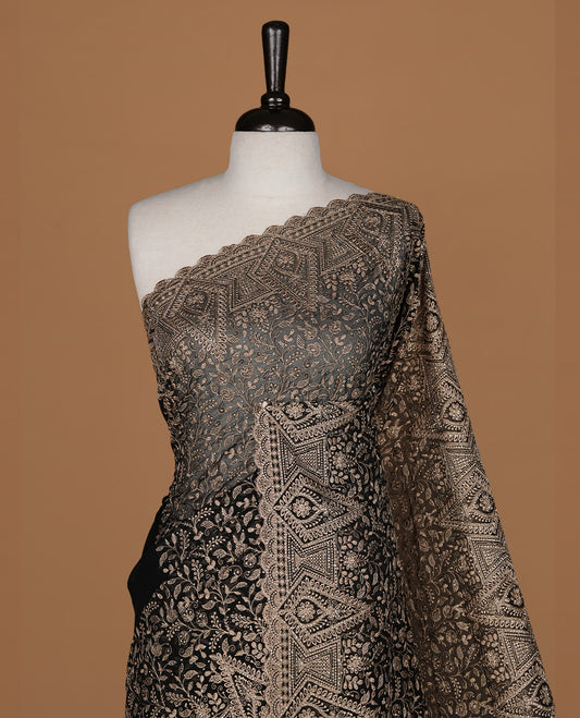 Black colour georgette designer saree featuring Gold thread floral pattern on body highlighting with stone and scalp border, paired with matching blouse piece.