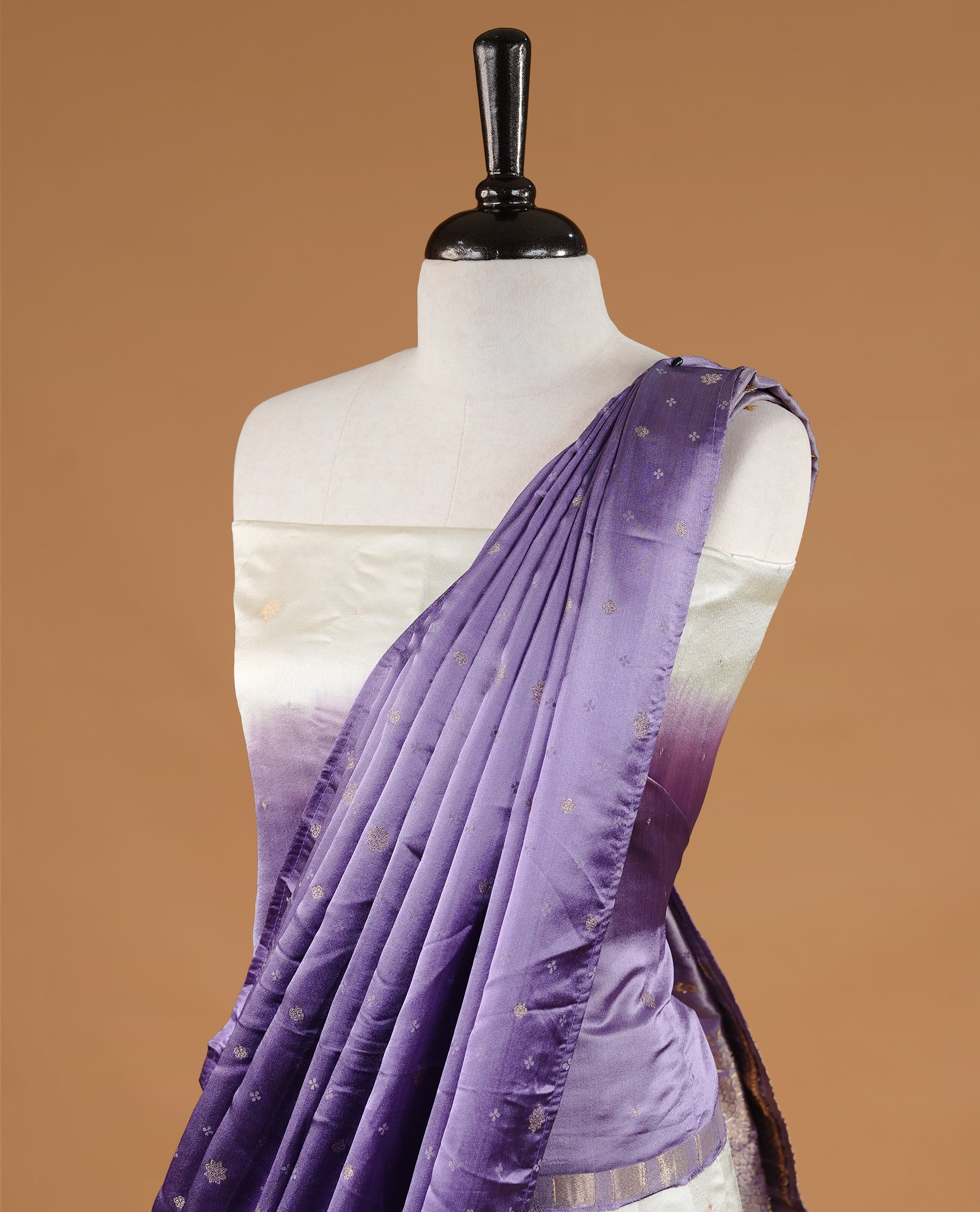 Off White colour half saree material featuring delicate zari buttas on the blouse and skirt, paired with a contrast Lavender zari border and matching small zari motifs dupatta