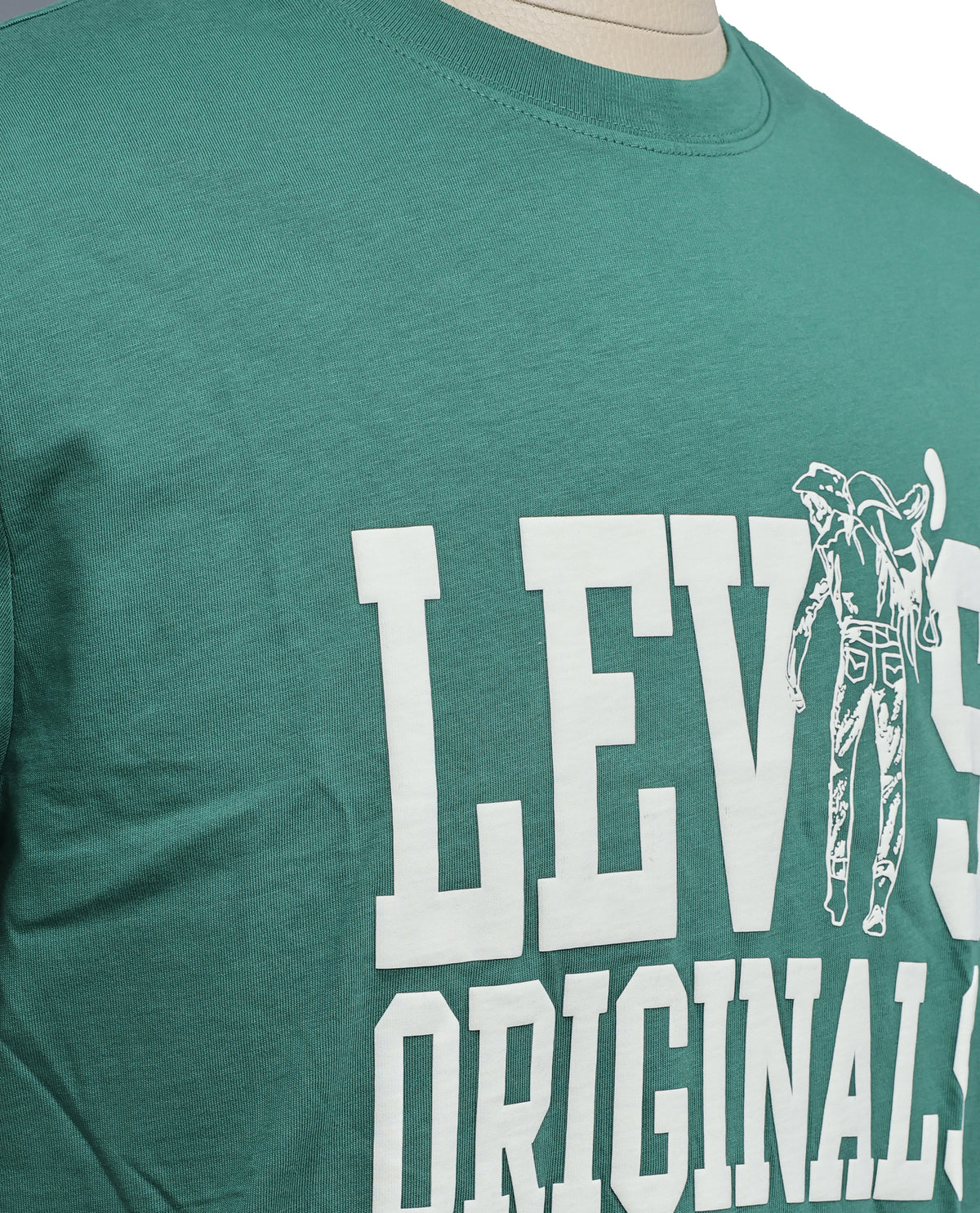 Green colour t shirt featuring round design neck, elegant Design body with a text, Half sleeve.