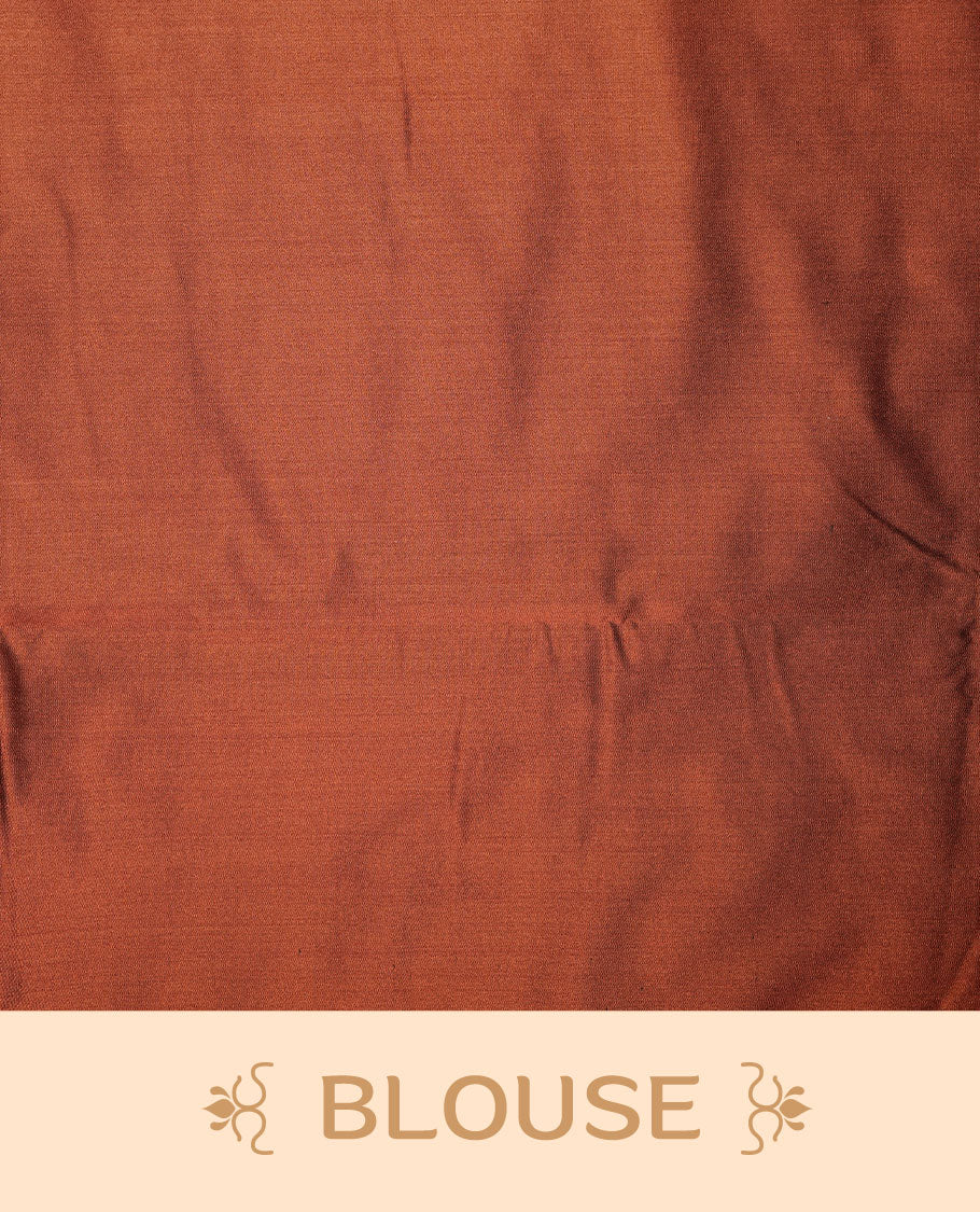 Navy blue colour soft silk saree features a sleek borderless design with intricate antique zari motifs, flowing into a striking contrast rust orange pallu and a matching blouse piece.