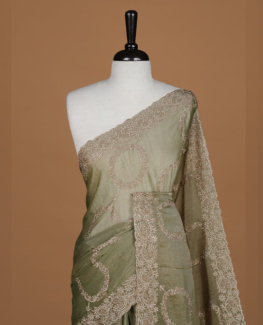 Olive colour organza saree featuring thread & gold stone pattern on body, highlighting scalp border, paired with Matching blouse piece.