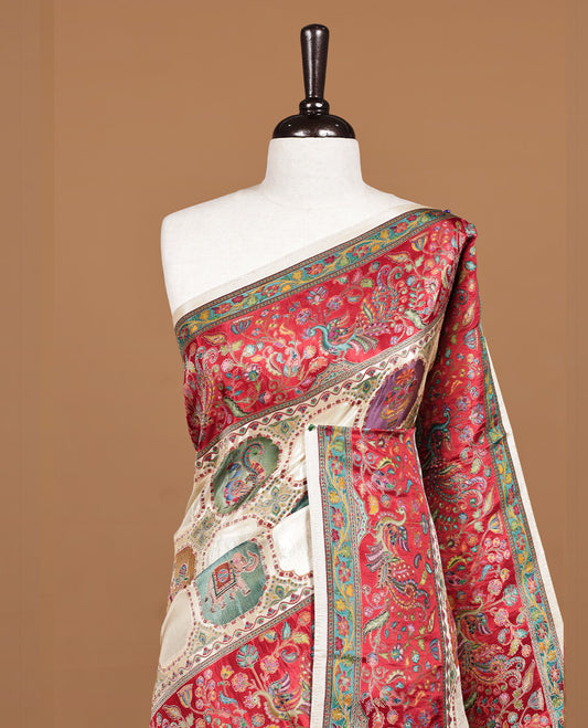 Cream colour Pashmina silk saree features an all over Multi colour box with motifs body, a contrast red peacock border and pallu, and a matching unstitched blouse.