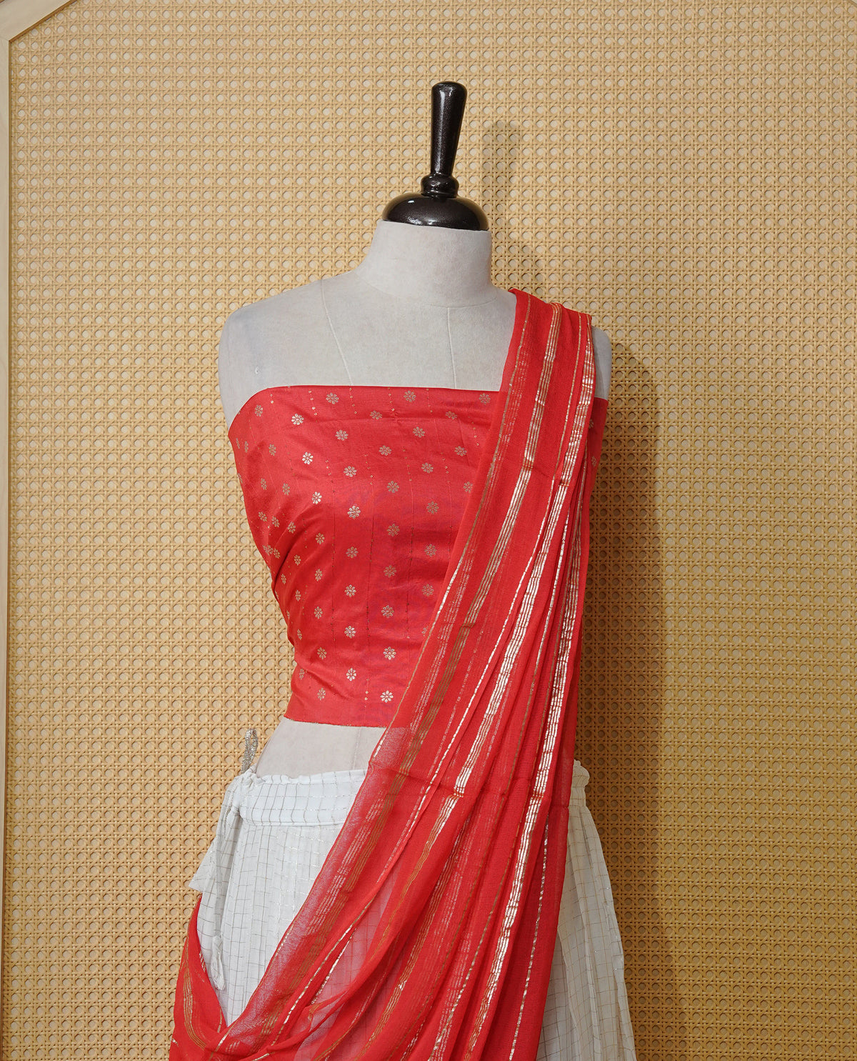 Off white colour Semi stitched dhavani set featuring Gold zari check pattern with contrast Orange border skirt, paired with matching blouse & dupatta.