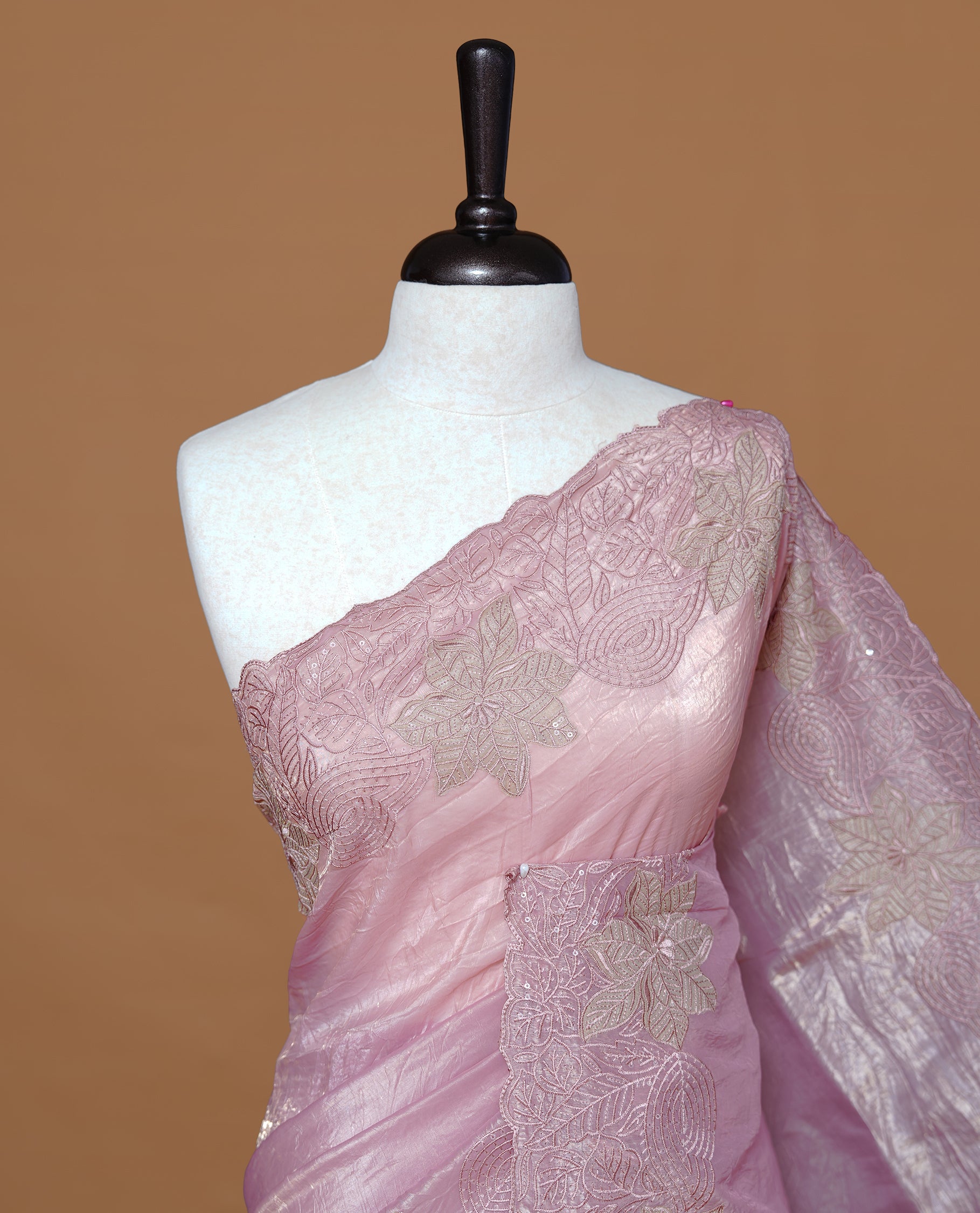 Pastel pink colour Crush Organza Featuring Plain body, Enrich with Floral thread pattern with sequins & scalp border, paired with matching blouse piece.