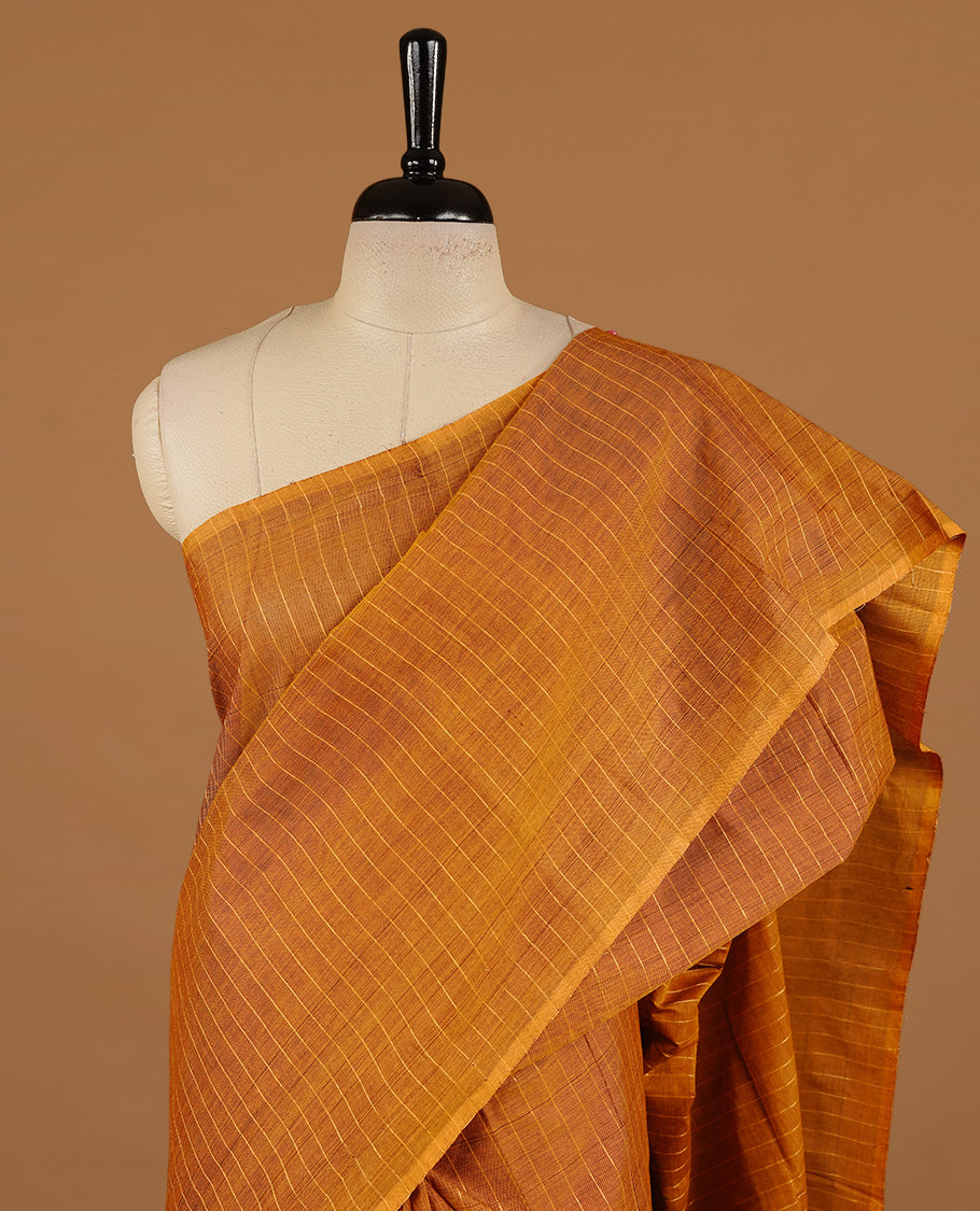 Mustard colour chettinad cotton saree featuring check pattern on body, complemented by self colour without border, paired with matching blouse piece.