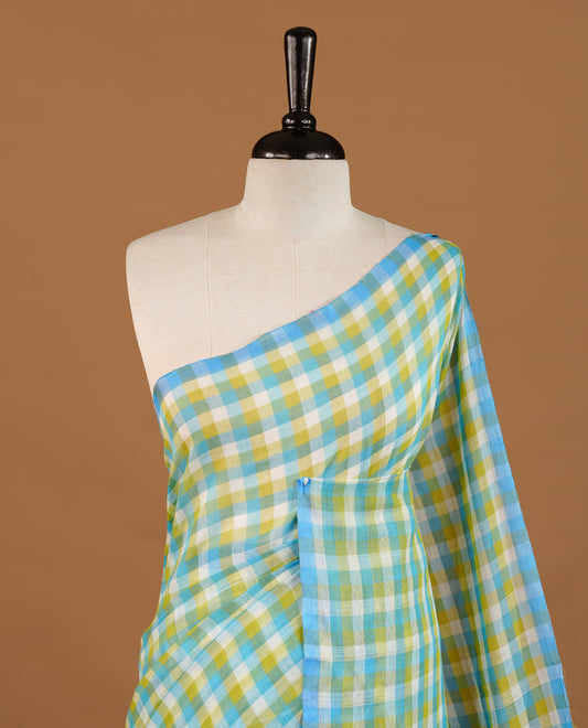 Blue, Green and White colour Mul Cotton saree featuring a classic Big check pattern on the body, accented with tassels for added charm. Comes without a blouse piece.