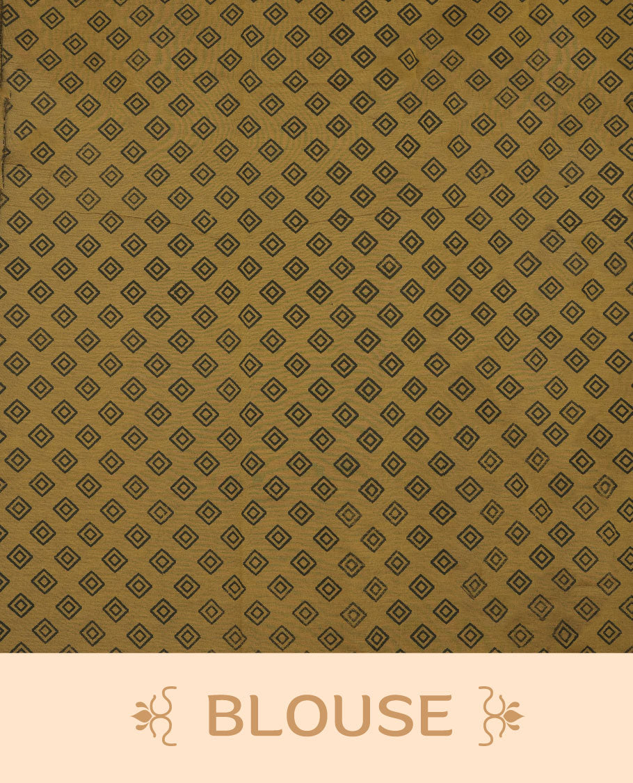 Dark mustard colour poly cotton saree with black temple motifs on the body, paired with a matching pallu with black woven traditional border, and a coordinated all‑over geometric printed blouse piece.