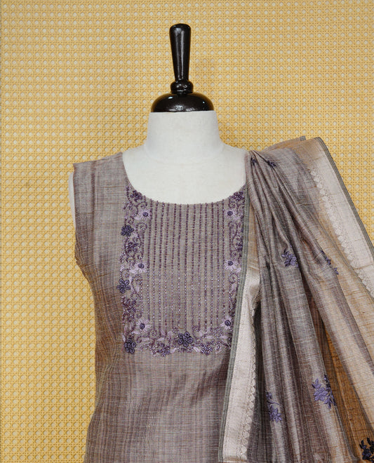 Dark Onion Pink colour Tissue Churidar Set featuring delicate floral embroidery and subtle bead detailing on the yoke, paired with matching solid pants and dupatta.