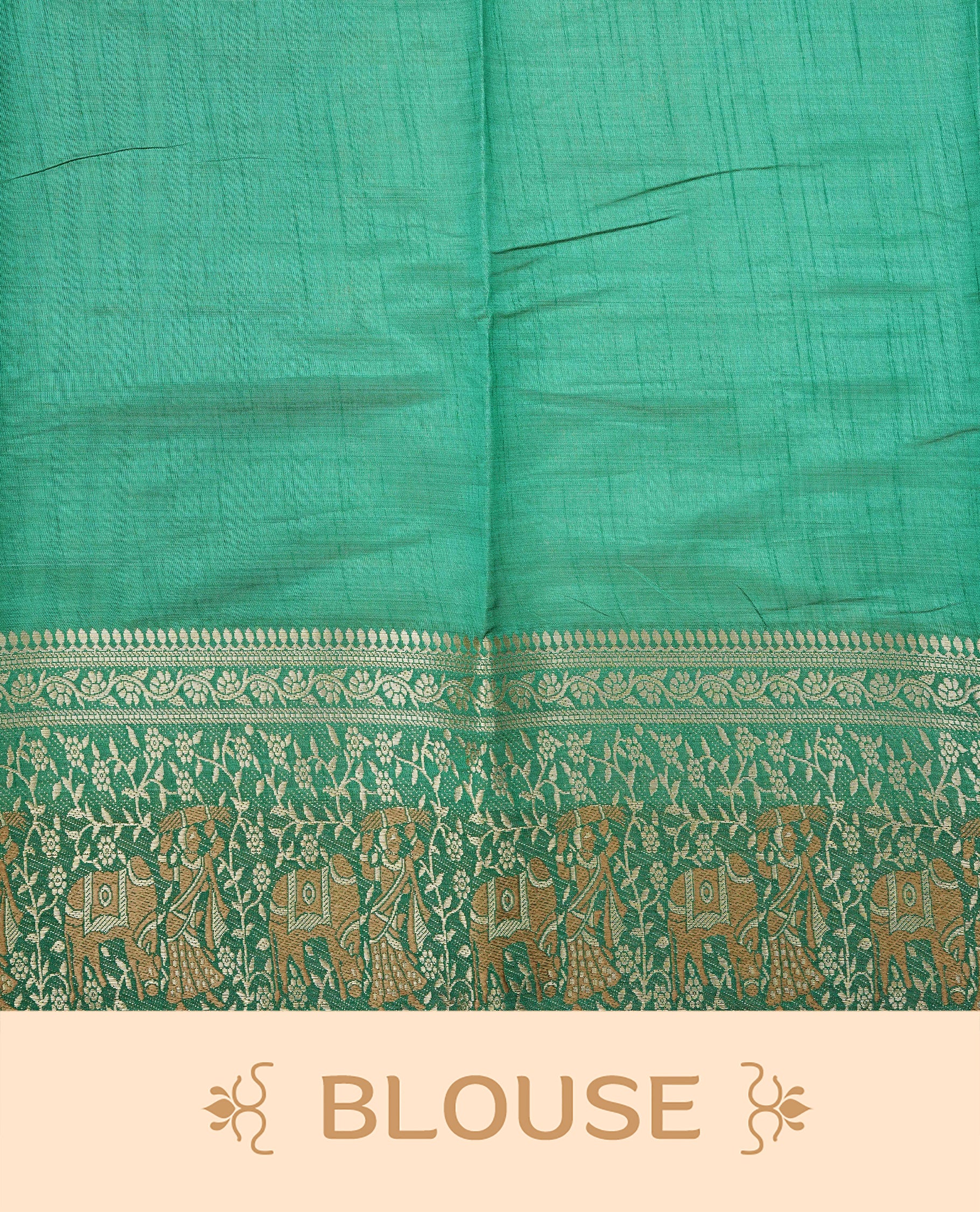 Light gold tussar saree featuring Elegant plain body, complemented by contrast green colour with Gold zari Floral kodi with Elephant Pattern border, comes with matching blouse piece.
