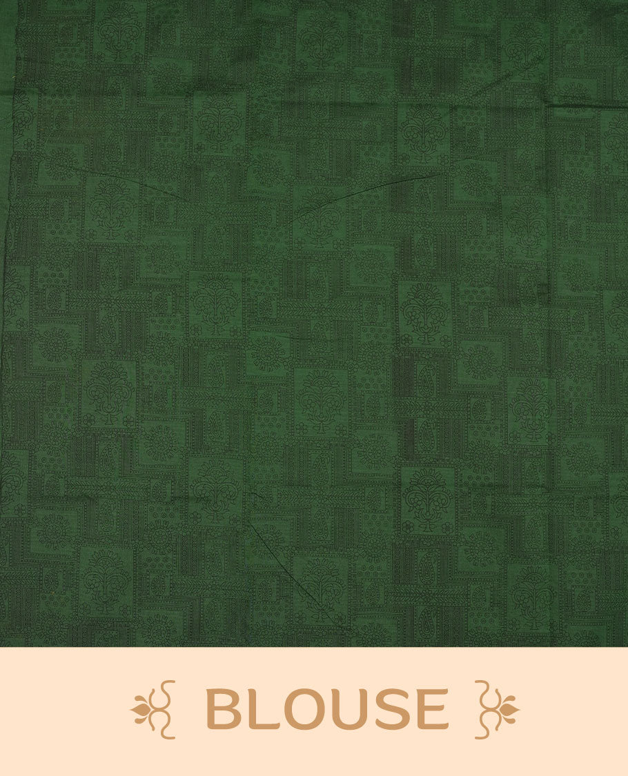 Dark green colour poly cotton saree with black zigzag line pattern on the body, paired with a matching pallu featuring black chevron lines and panelled floral‑paisley design, and a coordinated all‑over floral paisley patch‑style printed blouse piece.