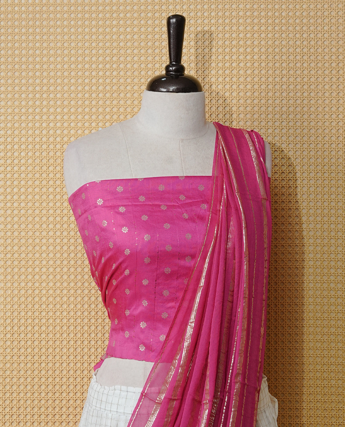 Off white colour Semi stitched dhavani set featuring Gold zari check pattern with contrast Magenta border skirt, paired with matching blouse & dupatta.