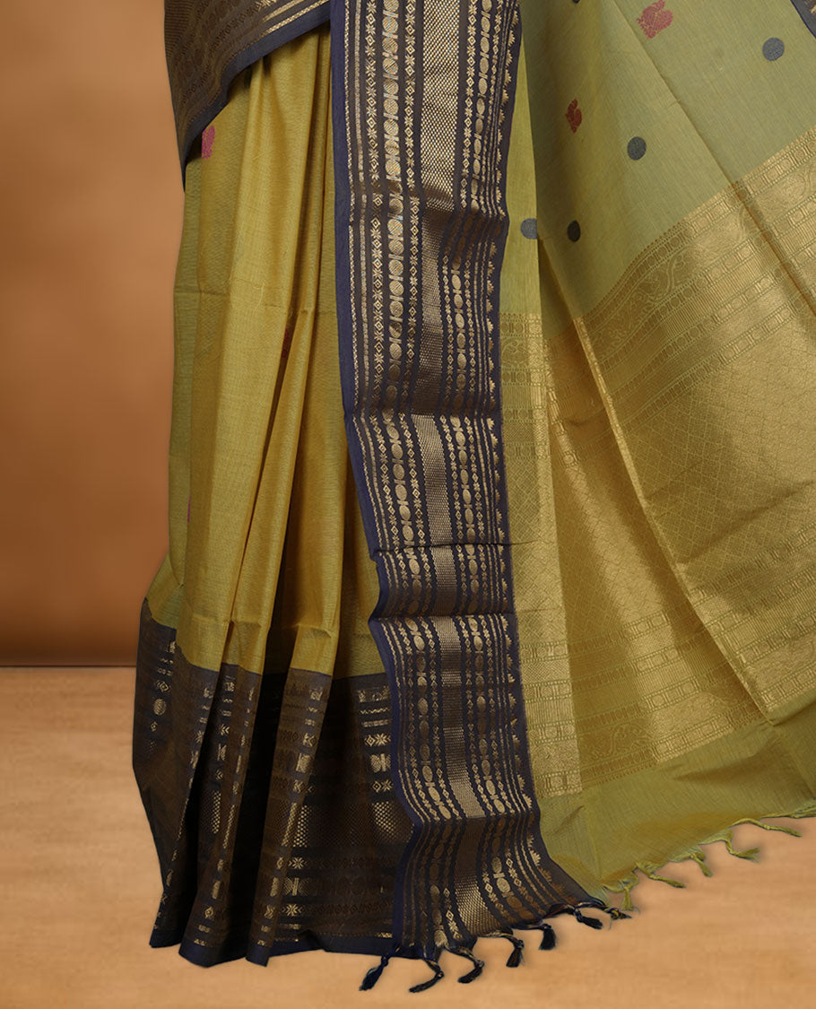 Olive colour chettinad cotton saree featuring Purple colour motifs on body, contrast purple colour border with gold zari border, pallu and paired with matching blouse.