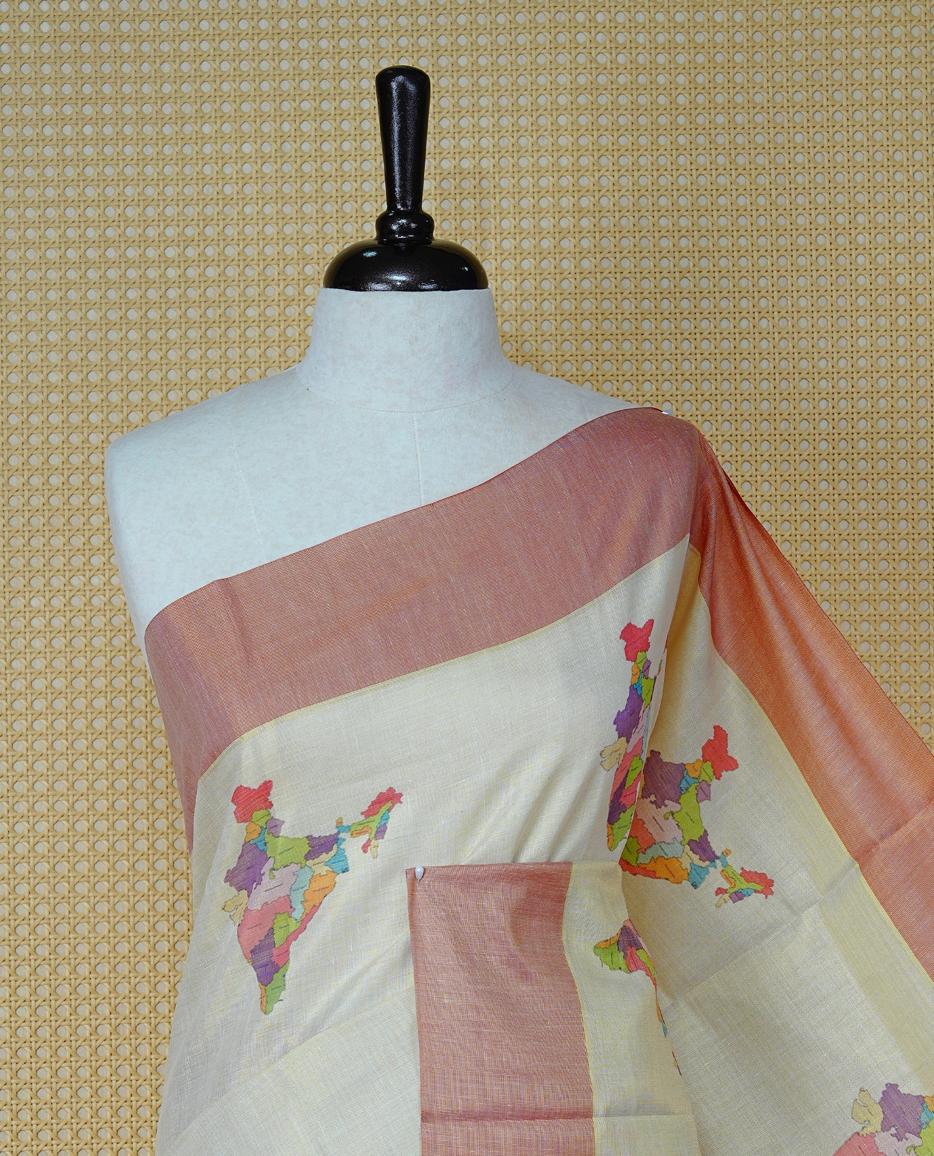 Cream Colour Kerala Saree Featuring Plain Body ,Complemented By A Red  Zari With Indian Map Border ,Enhance By A Gold Zari & Red  Pallu ,Paired With A Matching Blouse Piece.