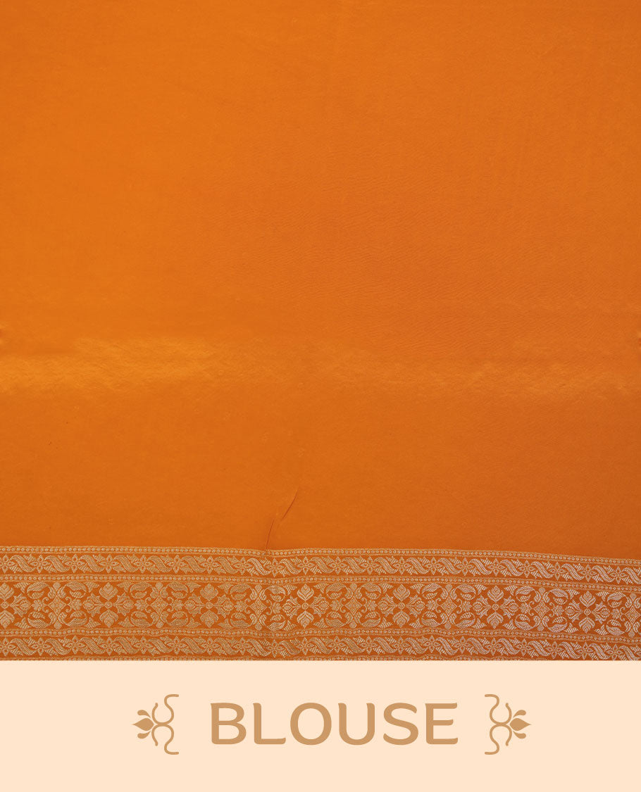 Orange colour banaras satin crepe saree featuring gold zari pattern across body, with self colour border with gold zari pattern and paired with matching blouse.