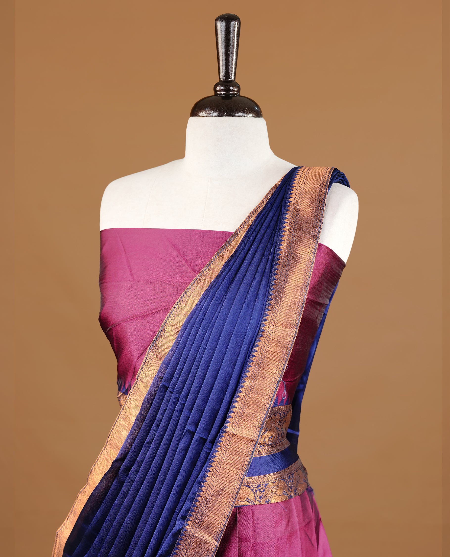 Burgundy colour semi stitched Half saree featuring contrast navy blue colour with Antique zari traditional border skirt, paired with matching zari border dupatta, unstitched blouse piece