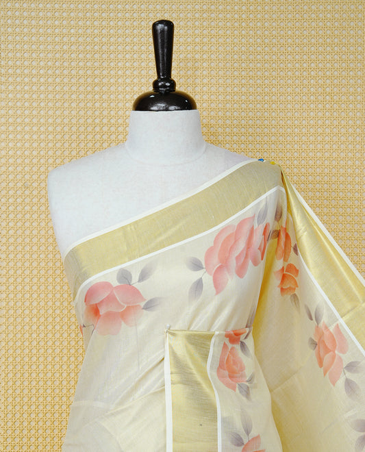 Cream Colour Tissue Kerala Saree Featuring Digital Peach Rose Prints Across The Body, Enhanced With A Gold Zari Border , Finished With Peach & White Tassels And A Matching Blouse Piece