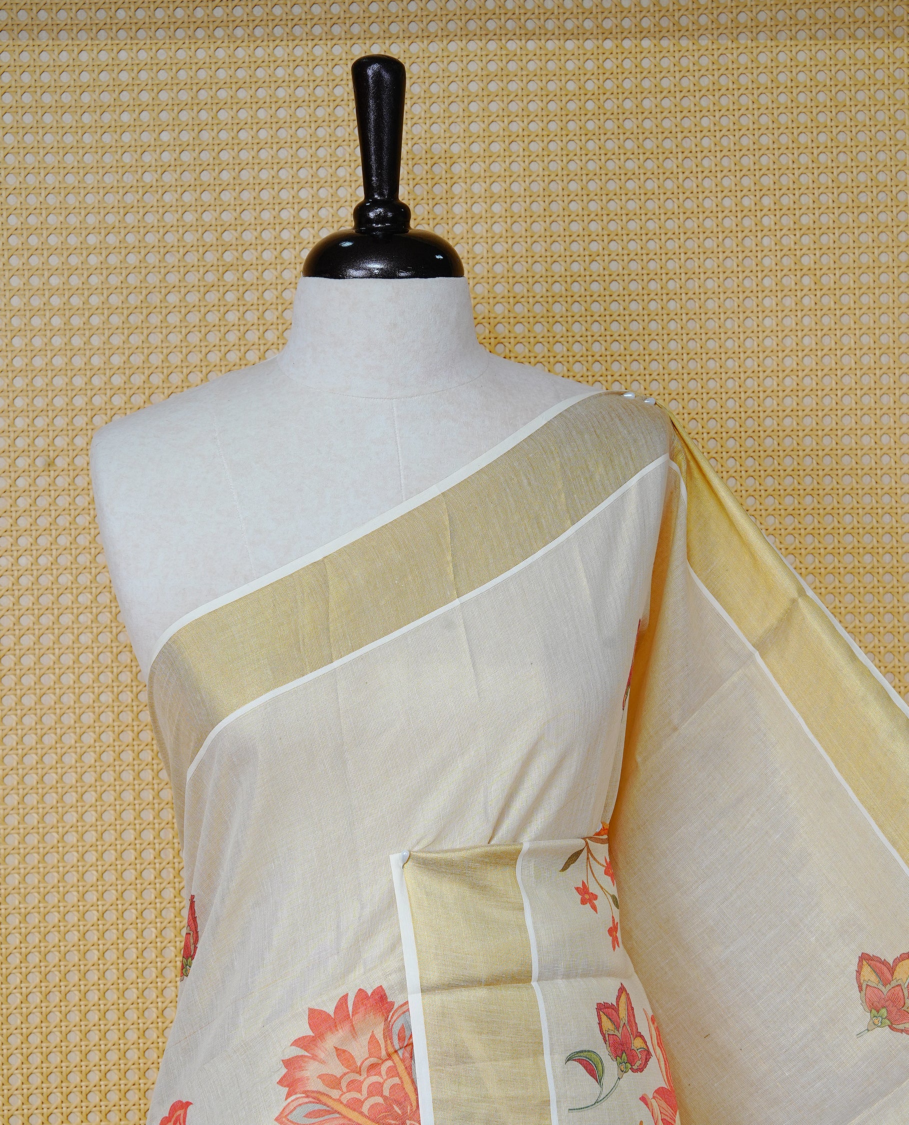 Cream Colour Tissue Kerala  Saree Featuring A Digital Floral Printed Body &  Pallu, , Beautifully Enhanced With A Classic Gold Zari Border And Red & Olive Green  Tassels, Paired With A Matching Blouse Piece.