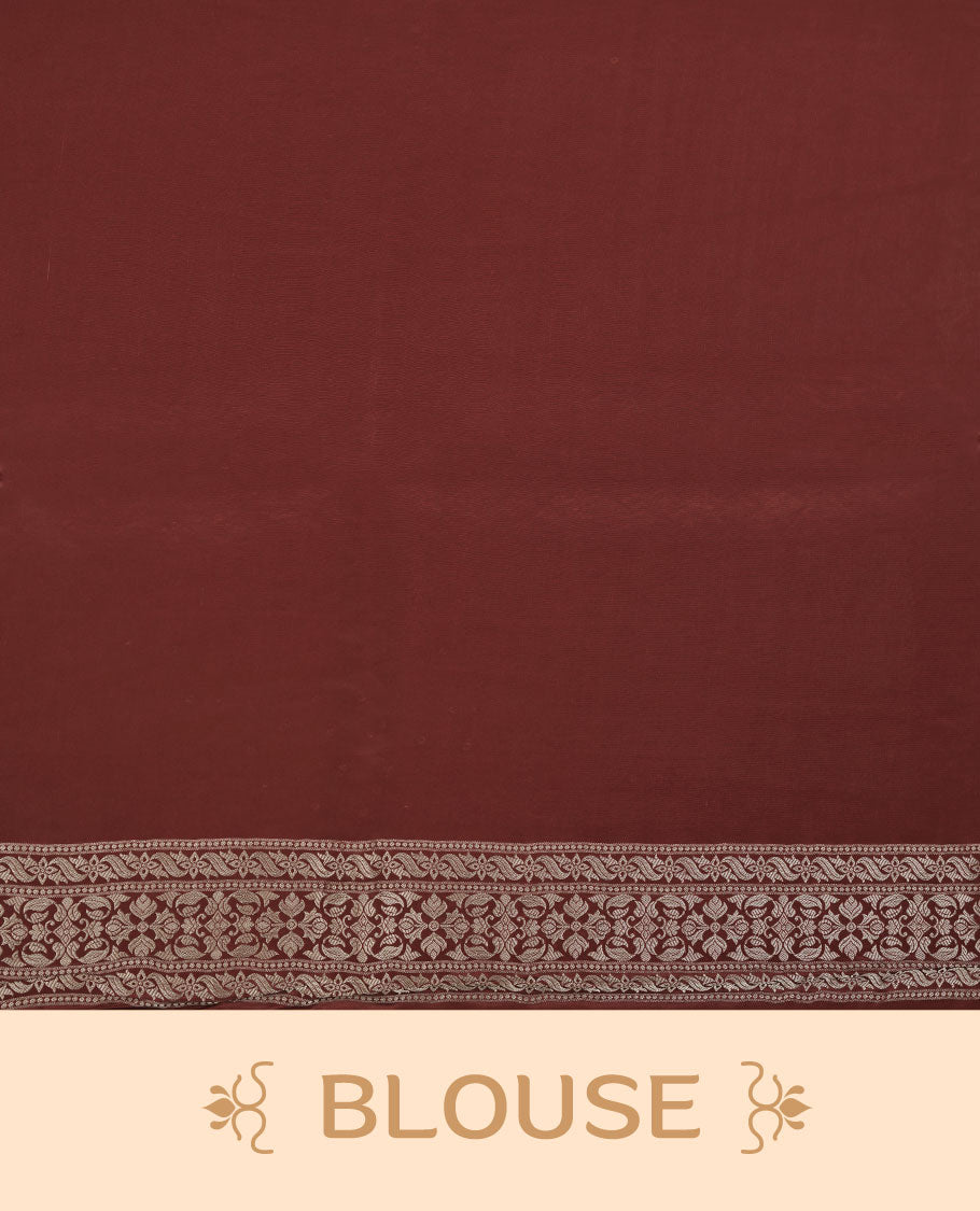 Chocolate brown colour banaras satin crepe saree featuring gold zari pattern across body, with self colour border with gold zari pattern and paired with matching blouse.