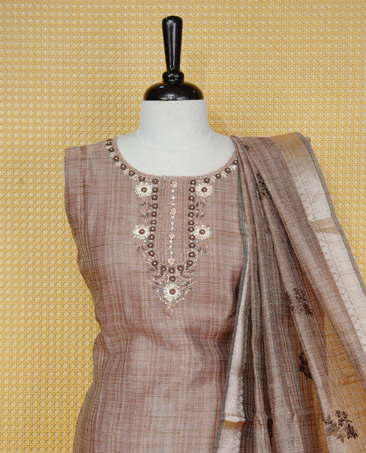 Brown colour Tissue Churidar Set featuring delicate floral embroidery and subtle sequin detailing on the yoke, paired with matching solid pants and dupatta.