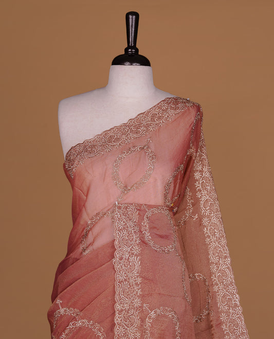 Pinkish orange colour organza saree featuring thread & gold stone pattern on body, highlighting scalp border, paired with Matching blouse piece.