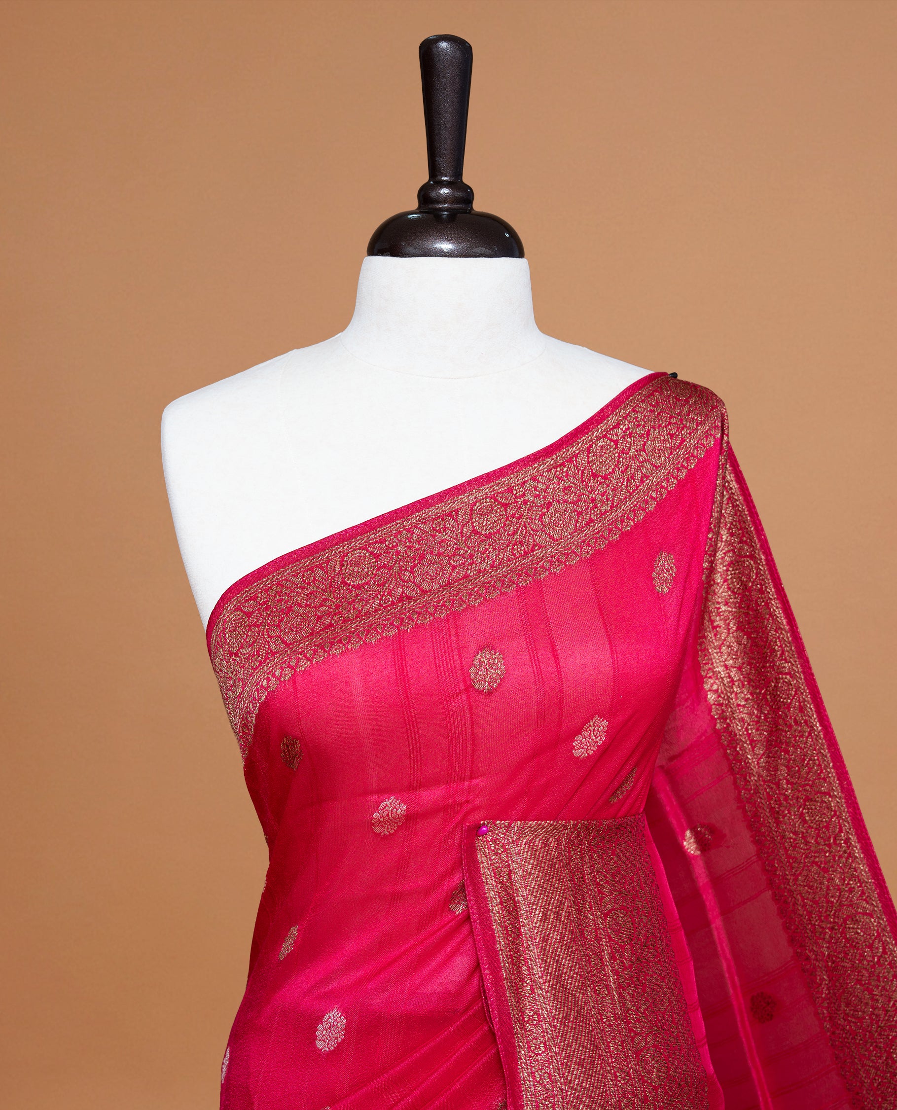 Magenta colour Semi banaras tussar georgette Saree featuring Antique zari motifs on body, enhanced with antique zari border, paired with a matching blouse piece.