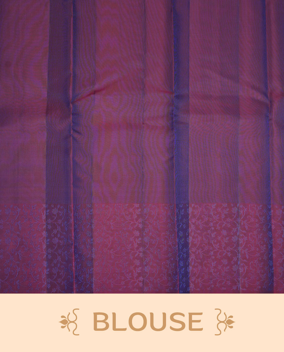 Peacock blue colour soft silk saree featuring zari pattern on body, complemented by a contrast purple zari patterned body, paired with matching blouse piece.
