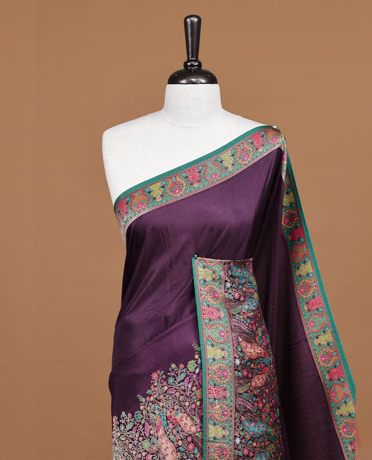 Deep Purple Pashmina silk saree featuring floral Pattern body, complemented by red border with multi colour Peacock & floral motifs, complete with matching blouse piece.