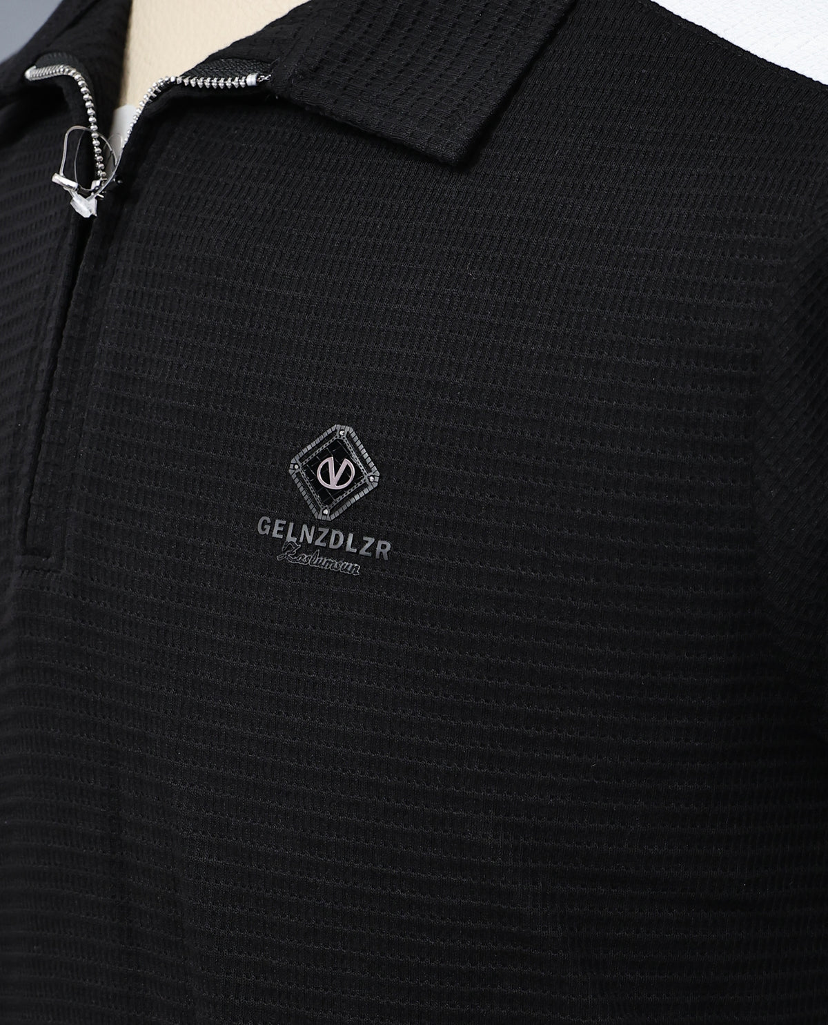 Black colour t shirt featuring collar design neck, elegant plain body with white on shoulder, Half sleeve.