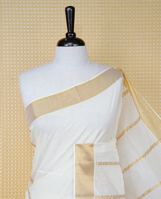 Cream Colour Cotton Kerala Saree Featuring an Elegant Plain Body, a Classy Gold Zari Border, and a Traditional Gold Zari Pallu with Maroon Accents, Paired with a Matching Blouse Piece.