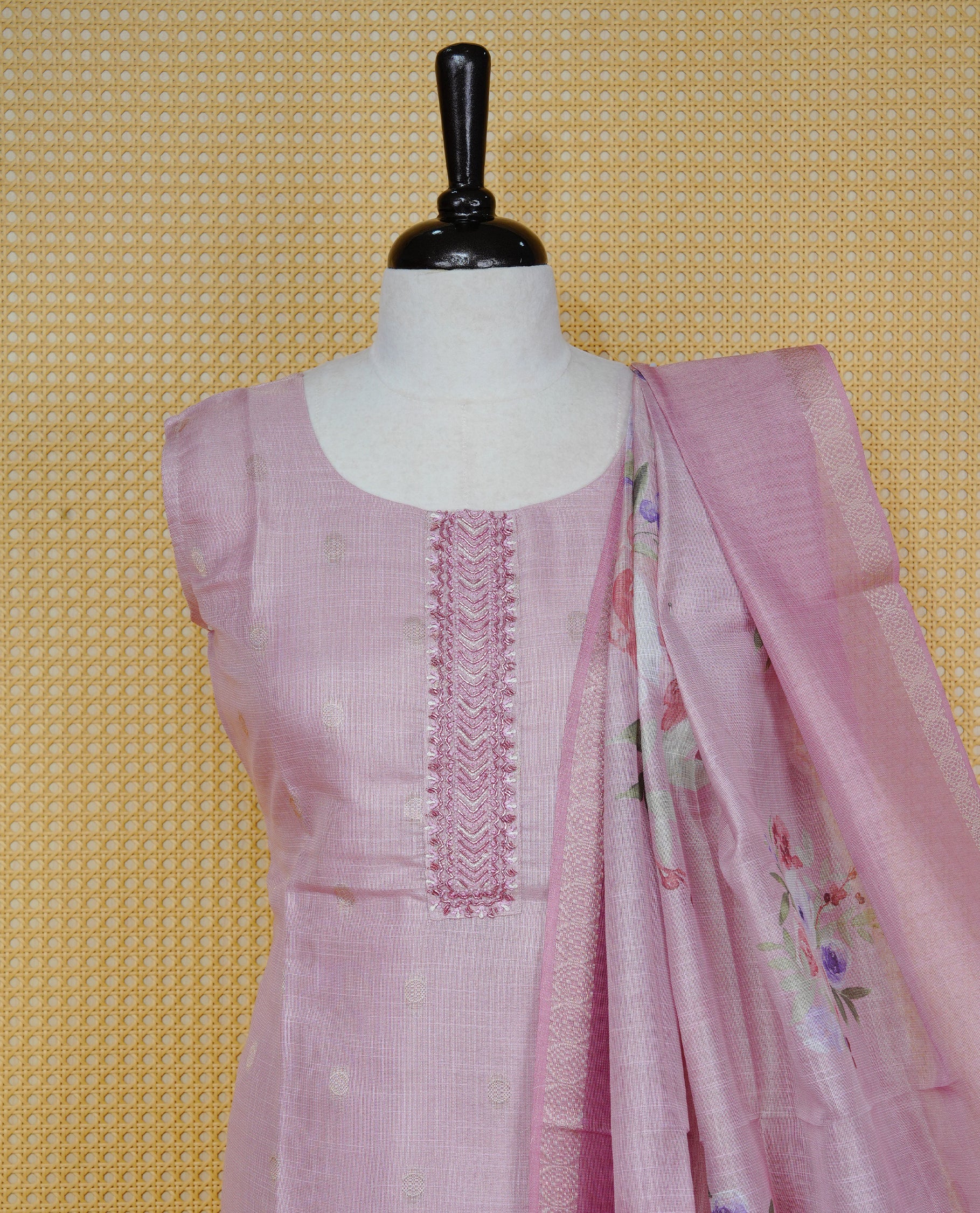 Dusty rose colour churidar set with delicate thread embroidery on the round neckline, featuring subtle woven buti detailing, paired with a matching floral printed woven dupatta and solid pants.