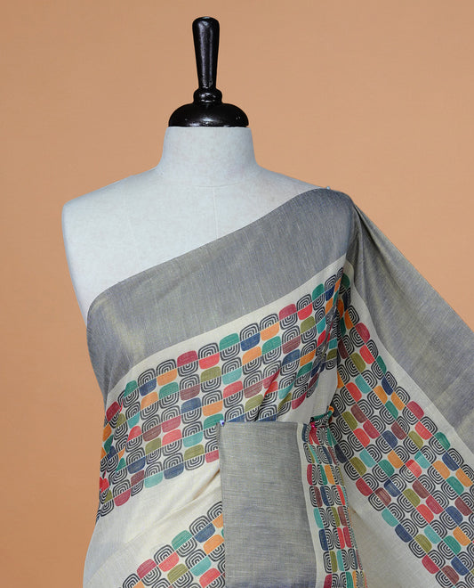 Cream colour Tissue kerala saree featuring Classy Multi colour Box pattern on body, Styled by navy blue & gold zari border and pallu, comes with matching blouse piece.
