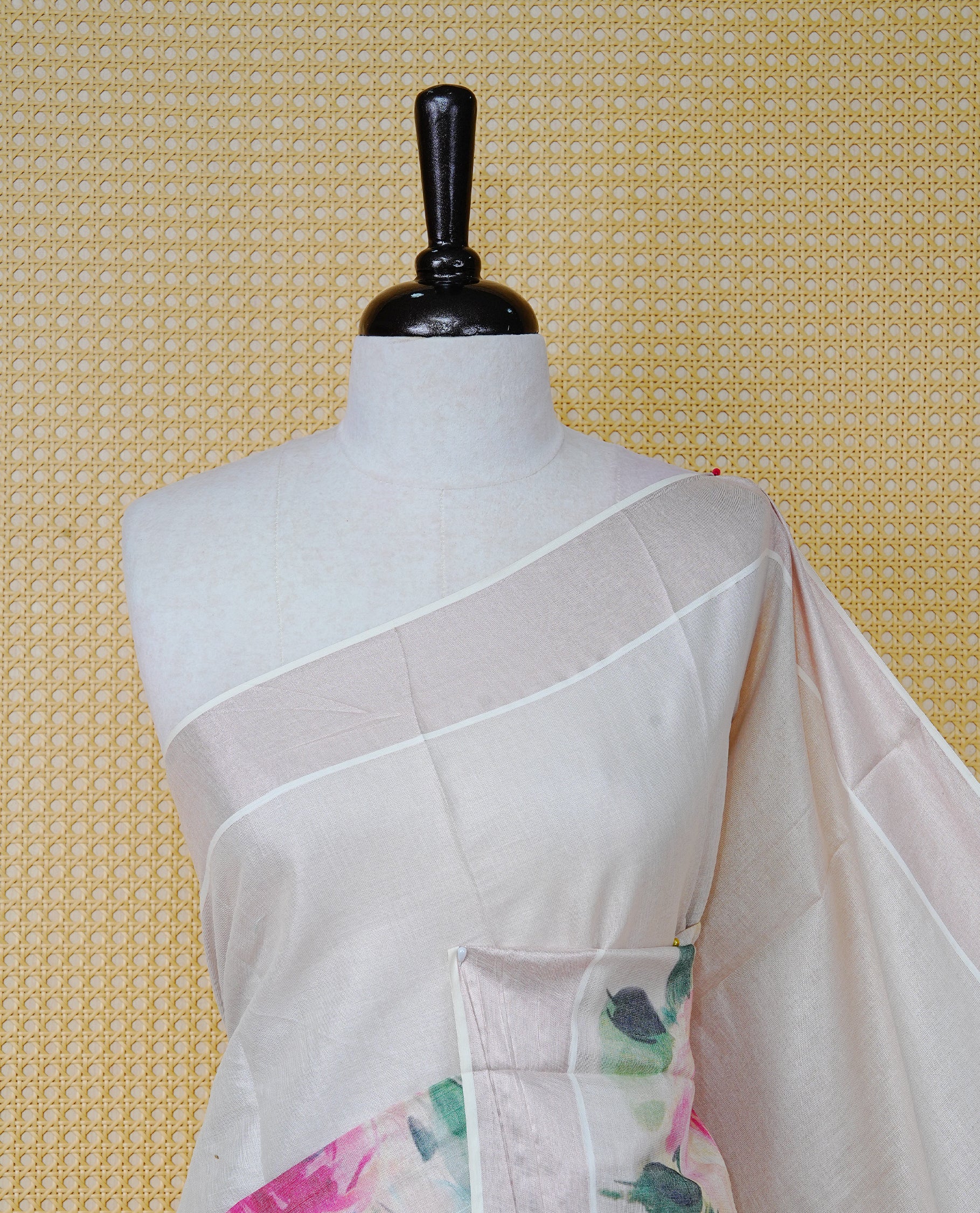 Cream Colour Tissue Kerala Saree Featuring Digital Floral Prints Across The Body, Enhanced With A Rose Gold Zari Border, Finished With Pink & Green Tassels And A Matching Blouse Piece