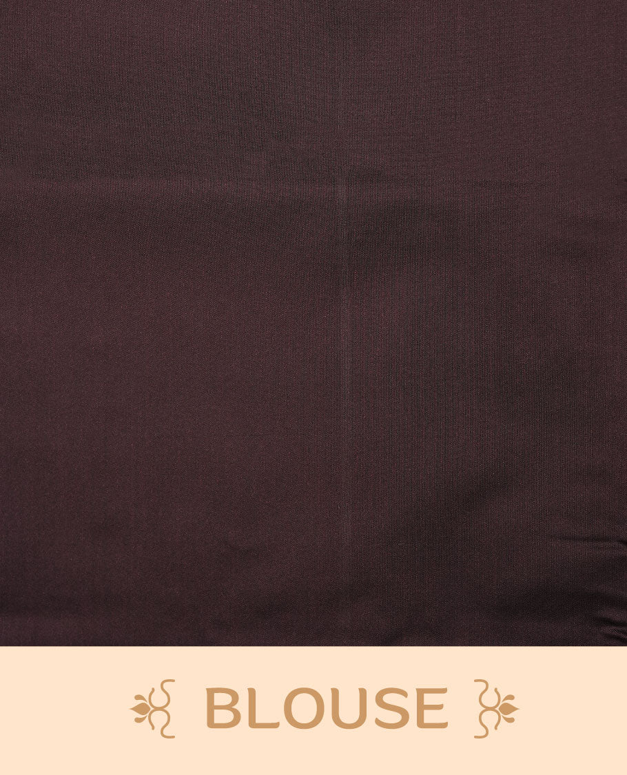 Rust orange colour soft silk saree features a sleek borderless design with intricate antique zari motifs, flowing into a striking contrast Black berry pallu and a matching blouse piece.