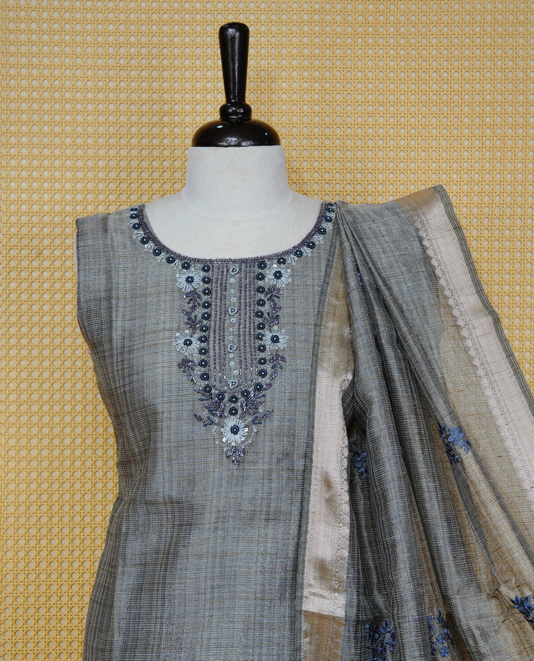 Blue colour Tissue Churidar Set featuring delicate floral embroidery and subtle bead detailing on the yoke, paired with matching solid pants and dupatta.