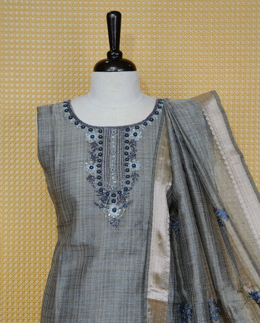 Blue colour Tissue Churidar Set featuring delicate floral embroidery and subtle bead detailing on the yoke, paired with matching solid pants and dupatta.