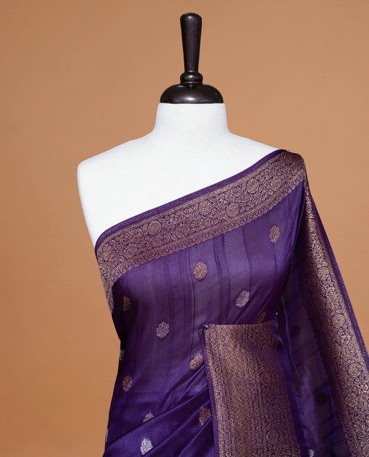 Violet colour Semi banaras tussar georgette Saree featuring Antique zari motifs on body, enhanced with antique zari border, paired with a matching blouse piece.