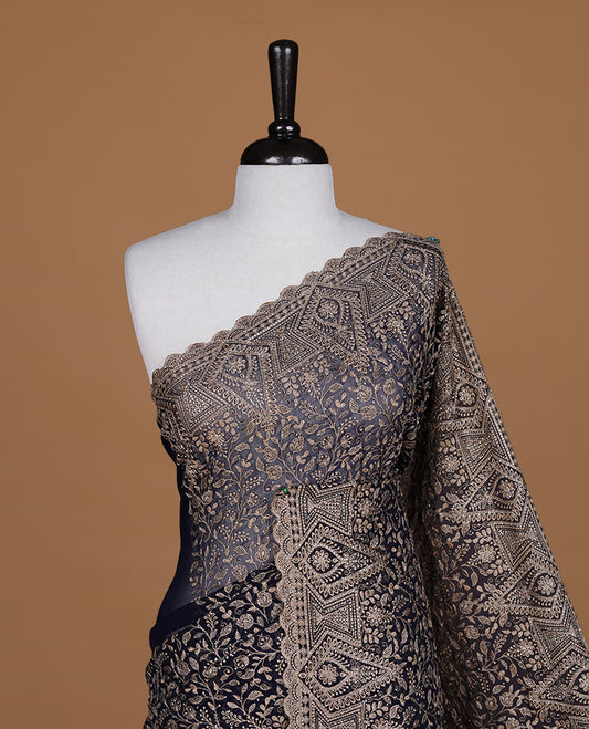 Dark blue colour georgette designer saree featuring Gold thread floral pattern on body highlighting with stone and scalp border, paired with matching blouse piece.