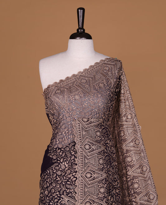 Maroon colour georgette designer saree featuring Gold thread floral pattern on body highlighting with stone and scalp border, paired with matching blouse piece.