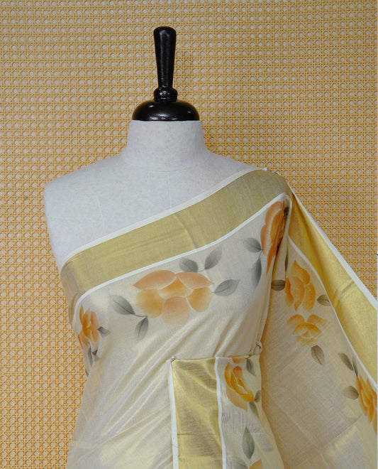 Cream Colour Tissue Kerala Saree Featuring Vibrant Floral Digital  Printed Border & Pallu , Beautifully Enhanced With A Classic Gold Zari Border And Contrast Tassels. Paired With A Matching Blouse Piece.