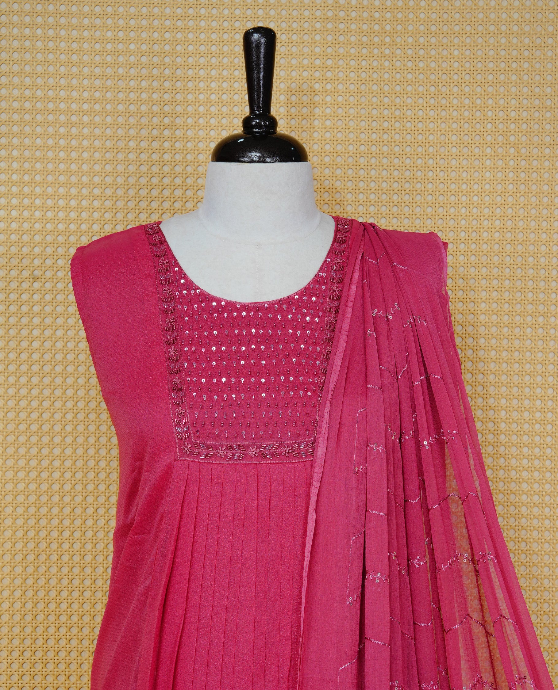 Pastel Raspberry Red Colour churidar set with sequins and bead embroidery on the round neckline, paired with a matching embellished dupatta and solid pants.
