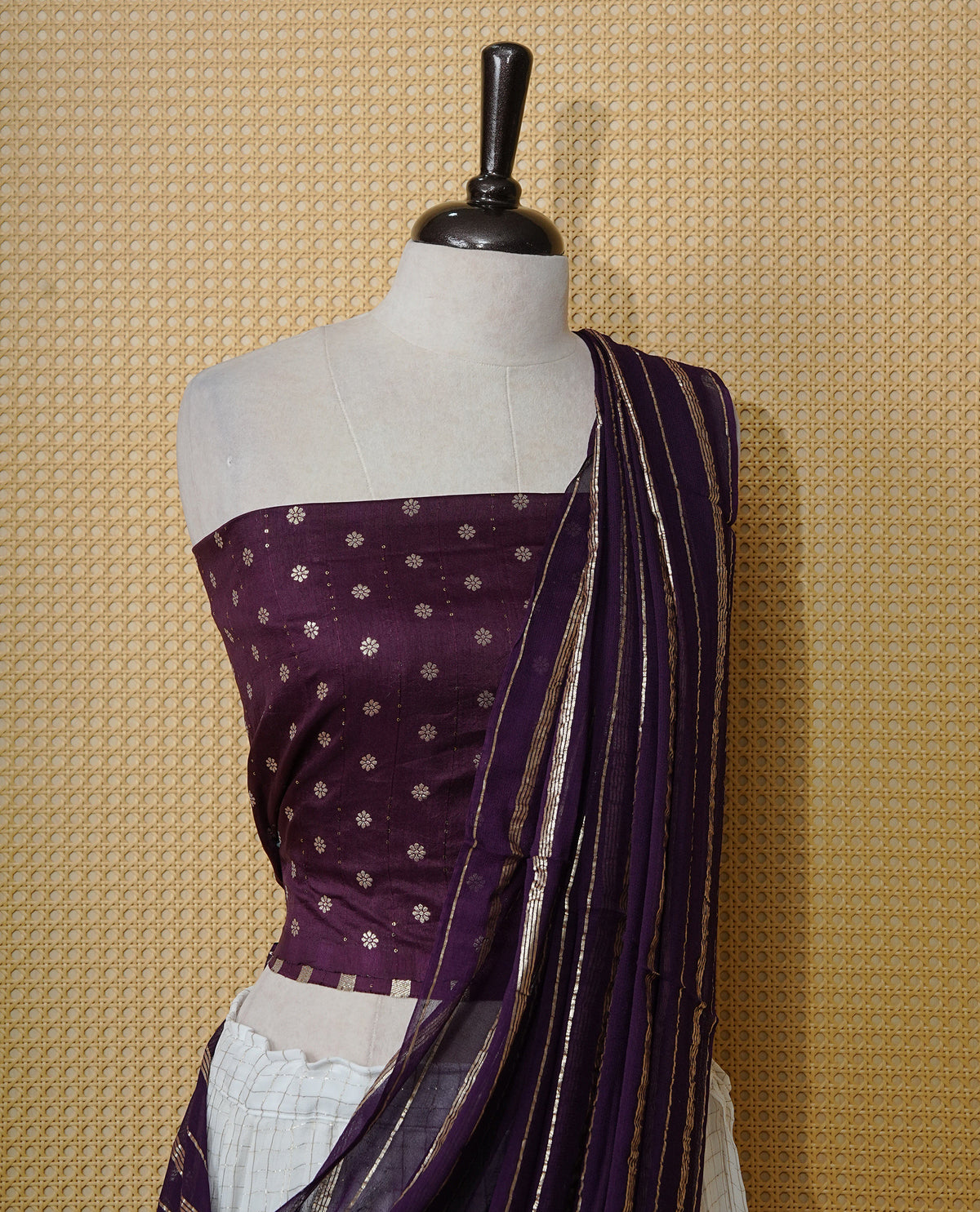 Off white colour Semi stitched dhavani set featuring Gold zari check pattern with contrast Violet border skirt, paired with matching blouse & dupatta.