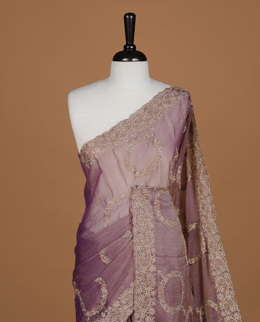 Purple colour organza saree featuring thread & gold stone pattern on body, highlighting scalp border, paired with Matching blouse piece.