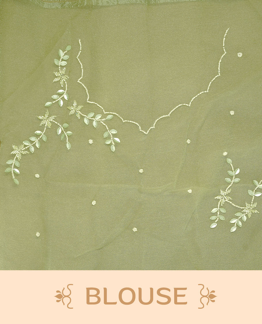 Pastel olive colour crush organza saree featuring white floral work with beats & sequins, highlighting scalp with beats worked border, paired with matching blouse piece.
