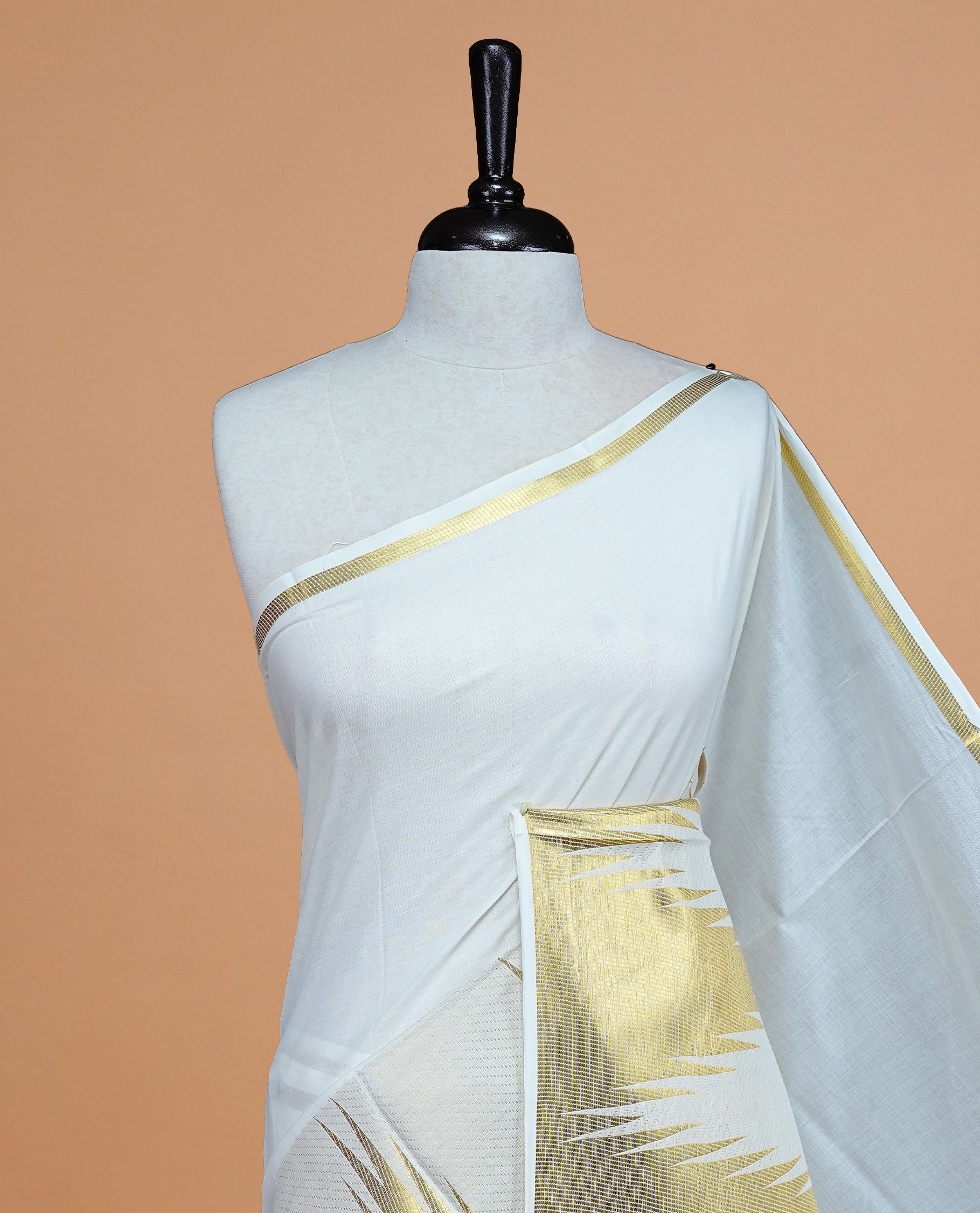 Cream Colour Cotton Kerala Saree Featuring  Temple Pattern On The Body ,Paired With A Matching Blouse Piece.