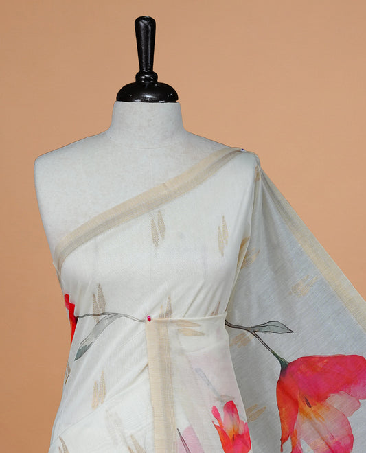 Cream Colour Organza  Kerala Saree Featuring Red Floral Print On The Body, Tassels On The Pallu With A Matching Blouse Piece.