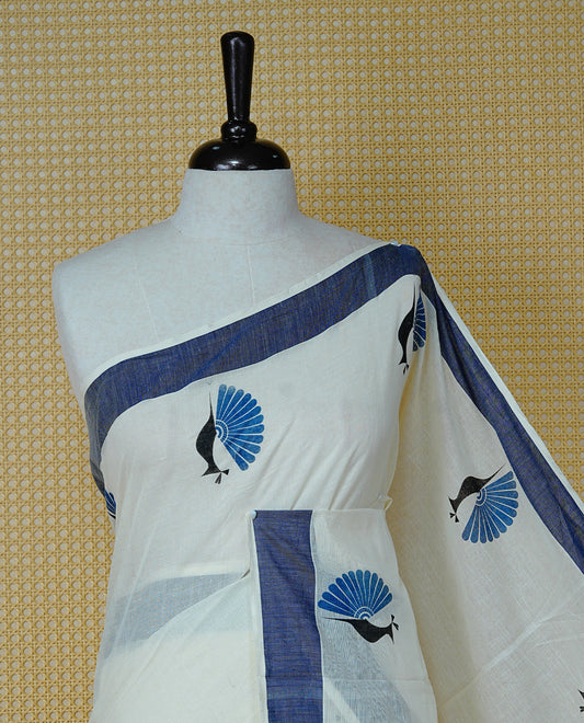 Cream colour Cotton Kerala saree Featuring Classy Plain body for Effortless Elegance, enhancing Navy blue with Peacock Printed border, paired with matching blouse piece.